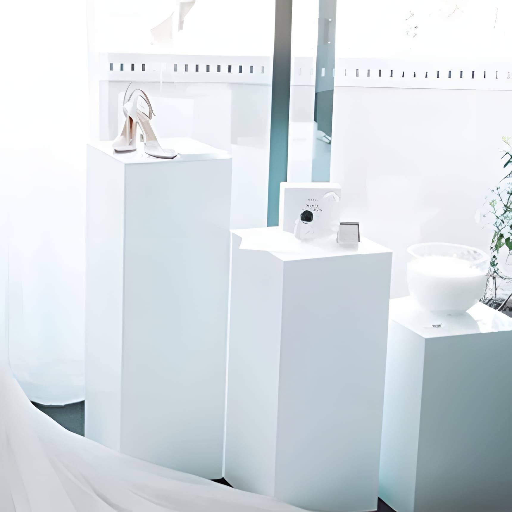 Set of three square white acrylic plinths